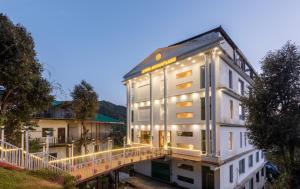 a building on a bridge with lights on it at Hotel Moonglade By Royal Stays Dalhousie in Dalhousie