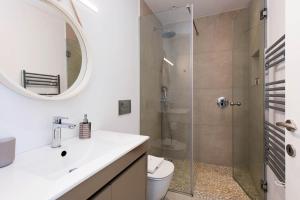 a bathroom with a shower and a sink and a toilet at Thea Estate in Kelliá +72 photos