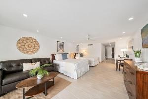 a living room with a bed and a couch at Maui Kaanapali Villas 119 · MKV 119 Newly Remodeled Garden View in Kahana +55 photos
