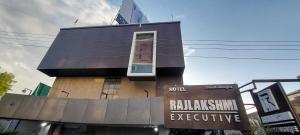 a building with a window on the side of it at Collection O Paithan Gate Formerly Rajlaxmi Executive in Aurangabad +13 photos