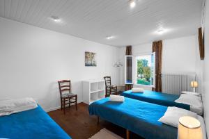 a bedroom with two beds and a window at Gite La Périgourdine in Saint-Laurent-des-Hommes +36 photos