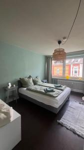 Ένα ή περισσότερα κρεβάτια σε δωμάτιο στο Urban chic in Gerresheim, a place to feel good