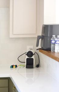 a kitchen counter with a toaster and a coffee maker at Docatange in Boisgasson