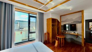a hotel room with a bed and a large window at Yesuhanshe Homestay in Zhangjiajie +24 photos