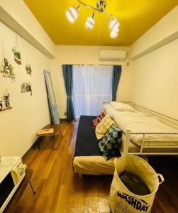 a bedroom with two beds in a room at KT-HouSe FUKUOKA 211 in Fukuoka