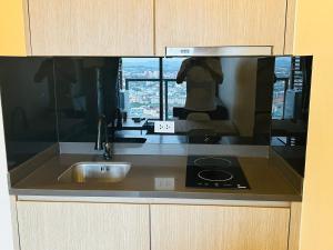 Η κουζίνα ή μικρή κουζίνα στο South pattaya Unixx hotel