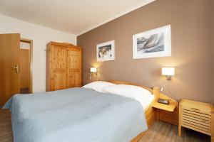 Postel nebo postele na pokoji v ubytování Bargmöhl 7 Inselsonne I