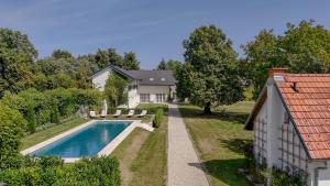 an aerial view of a house with a swimming pool at Luxus Villa mit großem Pool Alleinlage Nähe Graz in Erbersdorf