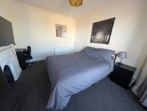 Ένα ή περισσότερα κρεβάτια σε δωμάτιο στο CosyRooms Central Bristol