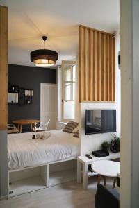 Una cama o camas en una habitación de Le Repos du Tertre