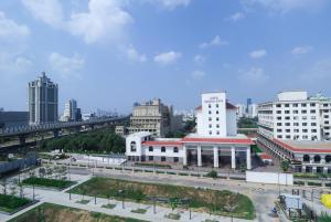 a view of a city with buildings and a bridge at AR Suites Sohna Road in Gurgaon