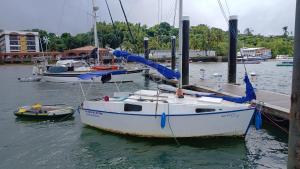 a group of boats docked at a dock in the water at Veleiro Ventão in Aracaju +3 photos