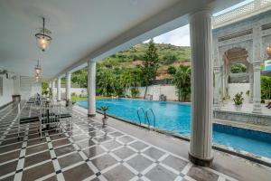 a view of the pool from the lobby of a house at Victoria Mansion - A Signature Collection by HST Hotels, Pure Vegetarian in Udaipur +87 photos