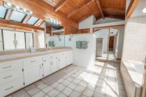 a bathroom with two sinks and a large mirror at Sequoia Vintage A-frame River Retreat in Three Rivers +71 photos