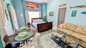 a living room with a couch and a table at Merritt Island hideaway in Merritt Island