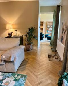a living room with a couch and a table at LAKE VIEW Luxury Apartment in Dunfanaghy