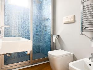 a bathroom with a shower and a toilet and a sink at La Perla di Ponente in Milazzo +33 photos