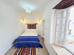 Ένα ή περισσότερα κρεβάτια σε δωμάτιο στο Riad Lailouza +19 φωτογραφίες