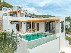 a house with a swimming pool in front of it at Staylar Sunrise Villas - Chaweng Noi, Koh Samui in Amphoe Koh Samui