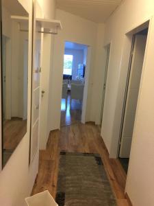 a hallway of an apartment with a living room at Deichnähe F in Norddeich