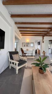 a living room with a couch and a table at Ajoupa Dielcane in Lamentin