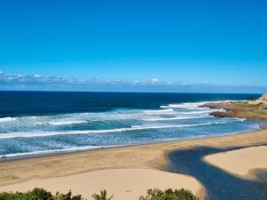 an aerial view of a beach with the ocean at Santana Resort 401 in Margate
