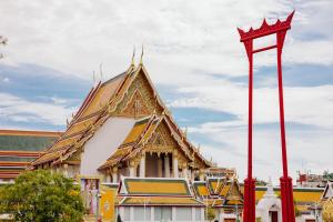 a building with a red pole in front of it at Samranscape in Bangkok