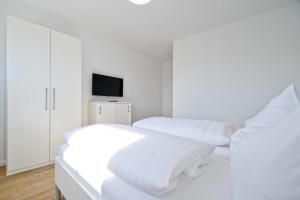 Ένα ή περισσότερα κρεβάτια σε δωμάτιο στο Deichstübchen unten +7 φωτογραφίες