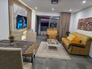 a living room with a couch and a table at The cozy corner in Hammamet