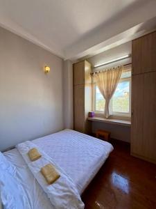 Postel nebo postele na pokoji v ubytování Gác Nắng La Vallée - 2pn valley view apartment + 2 fotografie