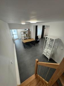 an empty room with a table and chairs and a room with a table at F 2 - 2 Zimmer Wohnung in Offenbach +23 photos