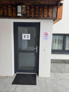 a front door of a building with a sign on it at F 2 - 2 Zimmer Wohnung in Offenbach