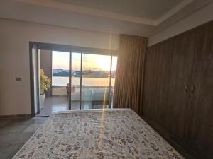 a bedroom with a bed with a view of the ocean at The cozy corner in Hammamet +20 photos