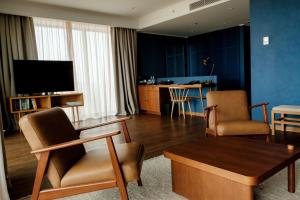TV a/nebo společenská místnost v ubytování BODBE Hotel