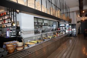 a food counter in a store with a counter at Hotel Omw Vore in Vorë +6 photos