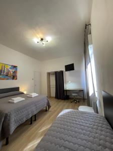 Llit o llits en una habitació de Empoli Loft - 20 minuti da Firenze - Toscana