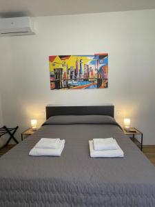 Postel nebo postele na pokoji v ubytování Empoli Loft