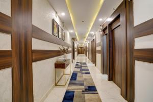 a corridor of a hotel with a hallway at FabExpress Diamond - Nr BKC in Mumbai