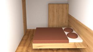 a bed with a wooden platform in a room at Haus Boarbauer in Kirchberg in Tirol +11 photos