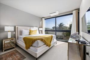 En eller flere senge i et værelse på Modern Luxury Stay at Daher Residence by Bocobay