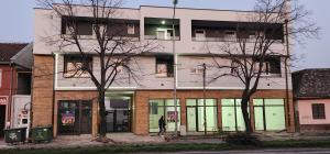 a person walking in front of a building at sobe za odmor in Petrovaradin