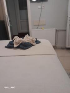 a pile of towels sitting on top of a bed at Fatih simge in Istanbul