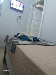 a bed in a room with a tv and a door at Fatih simge in Istanbul +27 photos