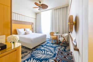 a hotel room with a bed and a desk at Grand Hotel Beauvau Marseille Vieux-Port - MGallery Collection in Marseille +69 photos