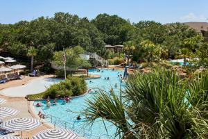a group of people in a pool at a resort at Grand Hotel Golf Resort & Spa, Autograph Collection in Point Clear