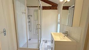 a bathroom with a shower and a sink at Gîte Les Champs N°3 in Saint-Mathieu +45 photos