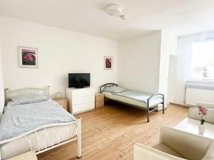 Ένα ή περισσότερα κρεβάτια σε δωμάτιο στο Work and Stay Troisdorf