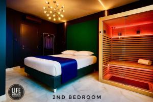 a bedroom with a large bed and a shower at LIFE VOYAGE & SPA - Strasbourg's City Center Luxury Experience in Strasbourg
