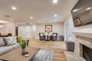 a living room with a couch and a fireplace at Destination #43 in Orange