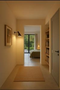 a bedroom with a bed and a door with a window at Dromdiah Lodge in Killeagh